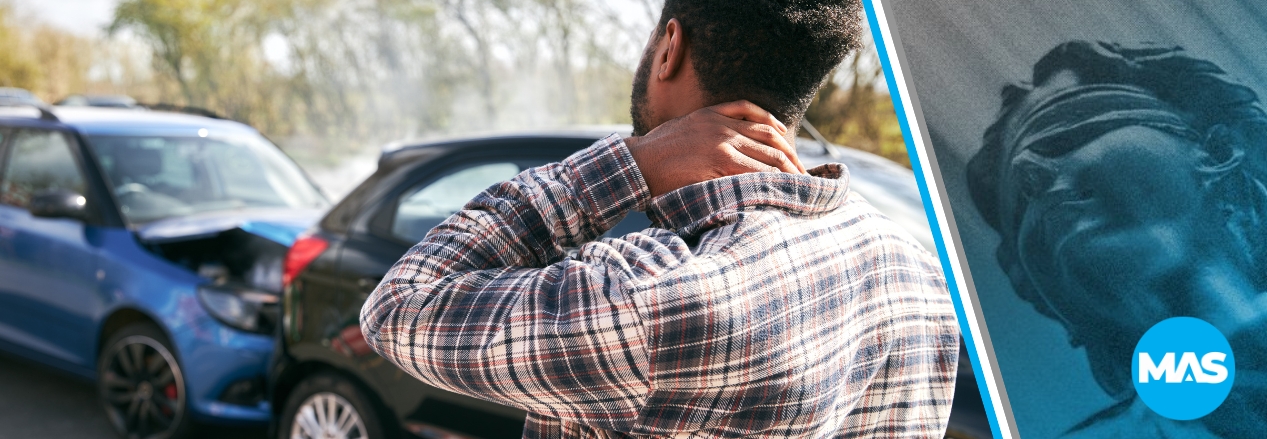 Man holding neck in pain after a car accident.