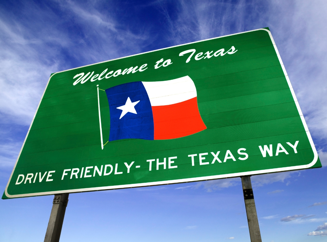 Road sign with "Welcome to Texas" on it.